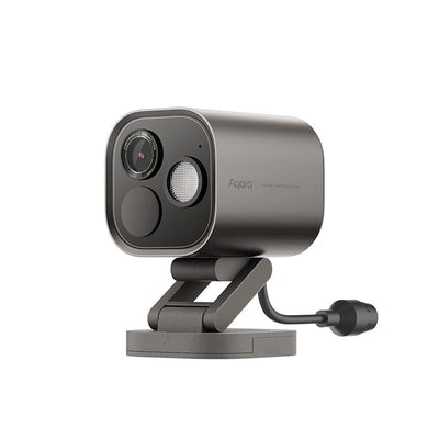 Aqara Camera Hub G5 Pro in Grau, schräg von vorn, Objektiv und Scheinwerfer sichtbar, Kabel am Standfuß
