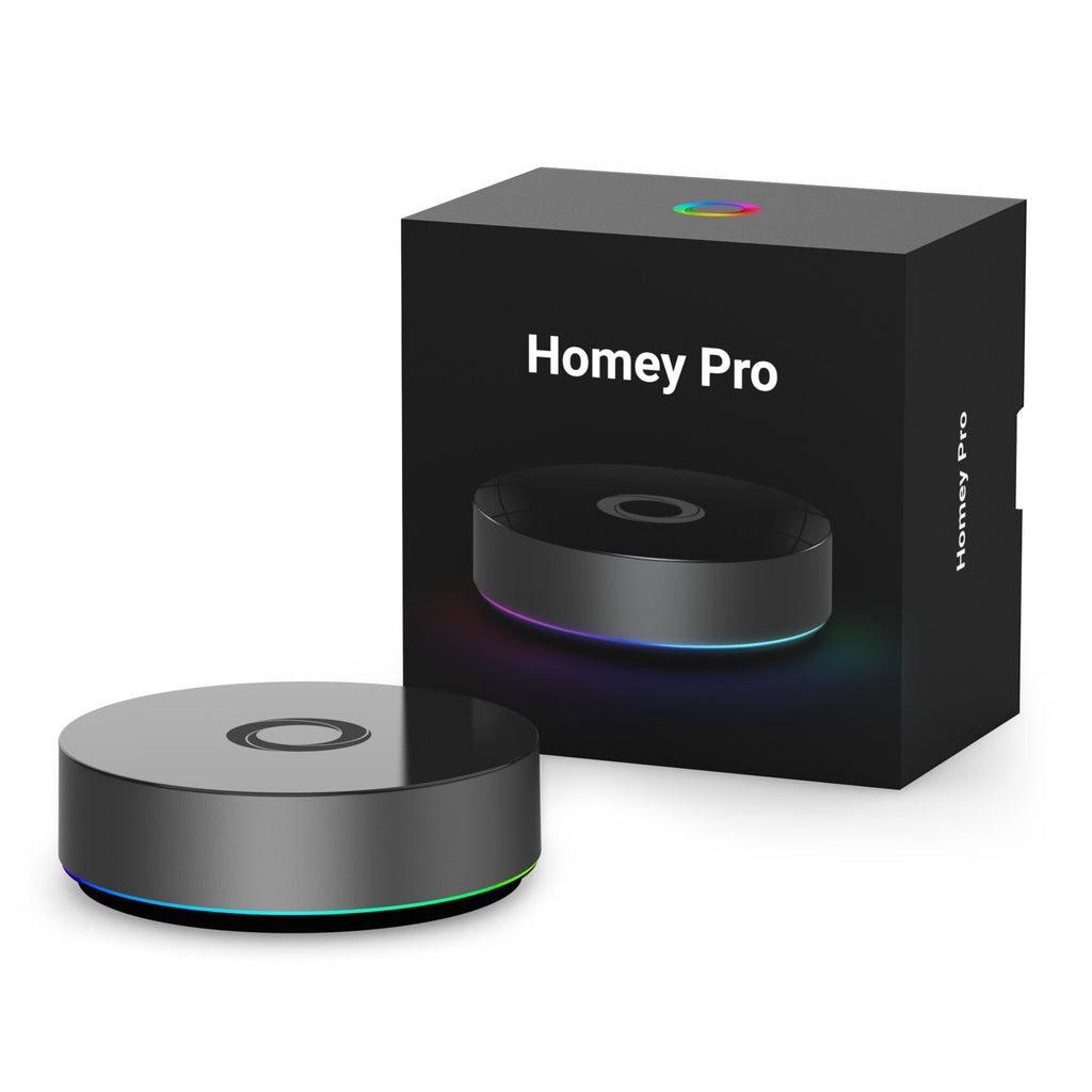 Athom Homey Pro als runder schwarzer Hub neben seiner Verpackung