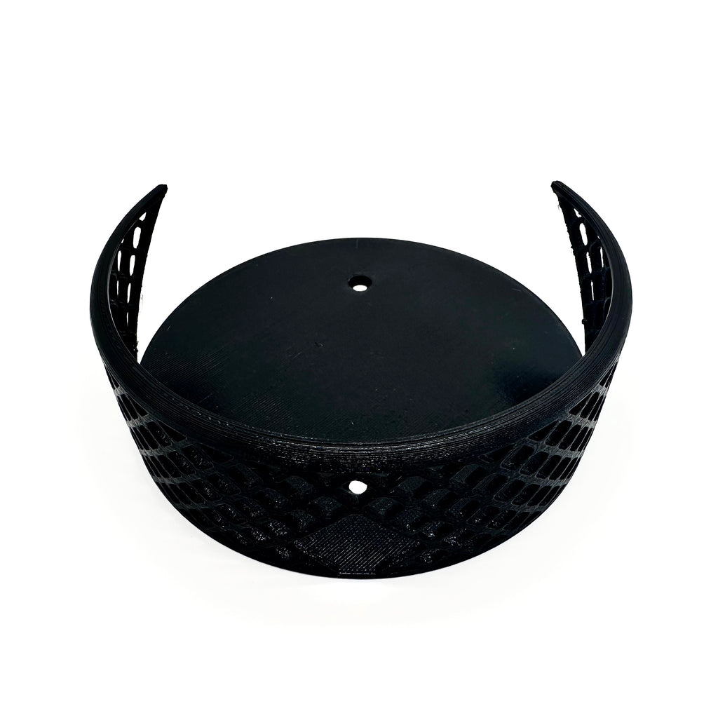 Leere Halterung von oben: zwei Haltearme und die offene Gitterschale