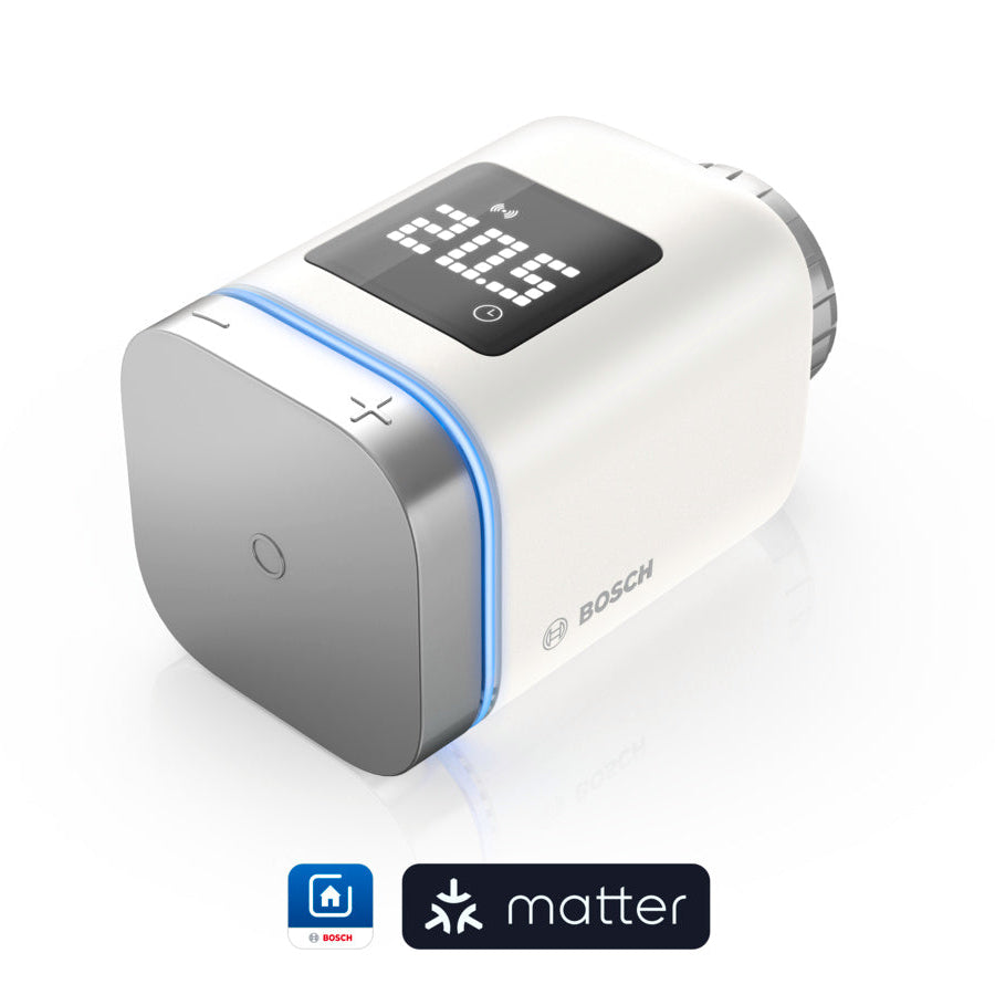 Heizkörper-Thermostat II [+M] liegend von schräg vorn, blauer Leuchtring und Plus-Minus-Tasten am Bedienring