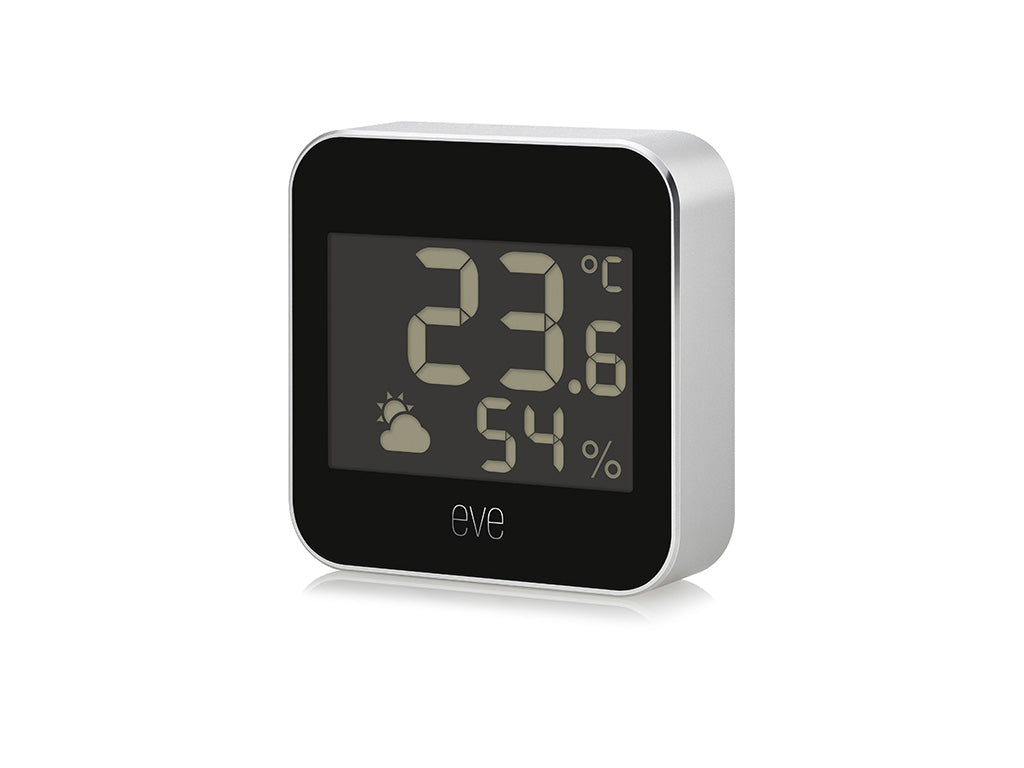 Eve Weather schräg von vorn, silberne Gehäuseseite rechts, Display mit 23,6 °C und 54 % Luftfeuchtigkeit