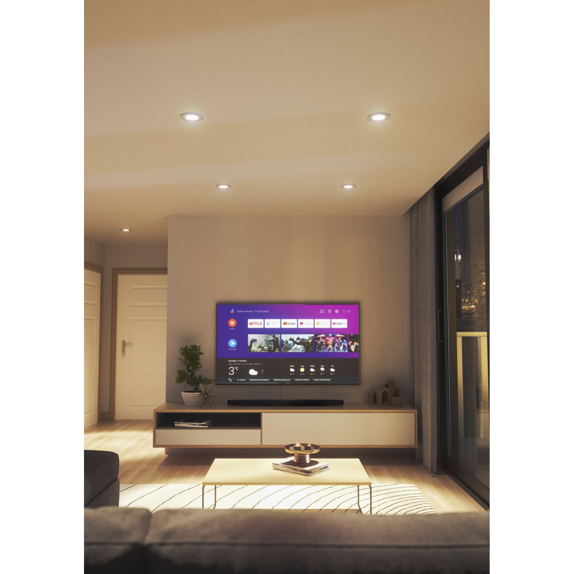 Wohnzimmer in warmweißem Licht der Nanoleaf Smart Spots, Decke und Couchtisch warm ausgeleuchtet