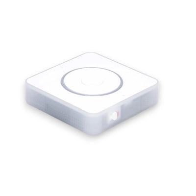 Home Assistant Voice Preview Edition schräg von oben mit Drehring, Mitteltaste und weiß-rotem Mute-Schiebeschalter