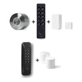 Nuki Smart Lock Ultra und Nuki Keypad 2 und Nuki Door Sensor u. a. nebeneinander vor weißem Hintergrund