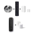 Nuki Smart Lock Ultra und Nuki Keypad 2 und Nuki Door Sensor u. a. nebeneinander vor weißem Hintergrund